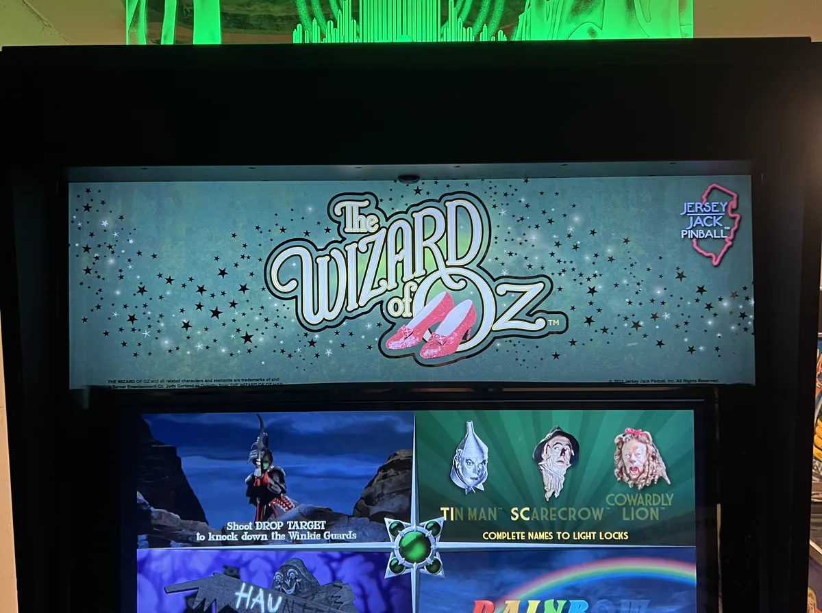 Glowing pinball machine at a dim event space