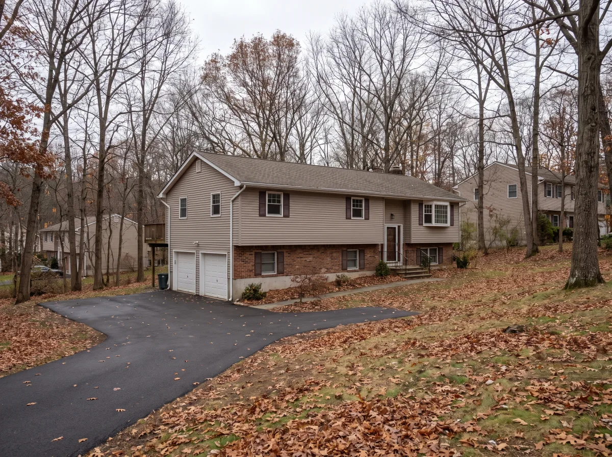 Raised ranch on a wooded Stony Point lot
